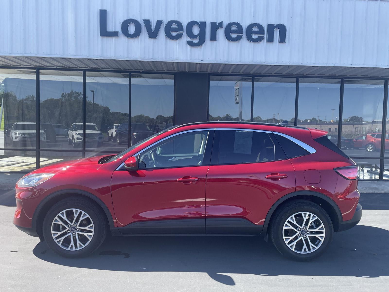 2022 Ford Escape SEL in Rapid Red Metallic Tinted Clearcoat — front three-quarter view