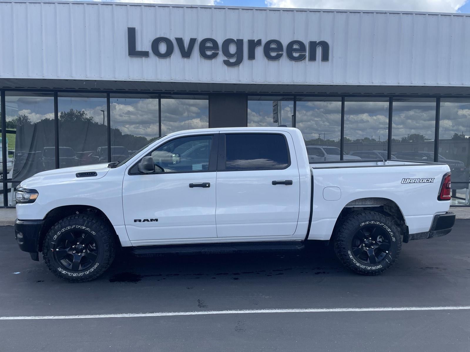 2026 RAM Ram 1500 RAM 1500 WARLOCK CREW CAB 4X4 5'7' BOX in Bright White Clear-Coat Exterior Paint — front three-quarter view