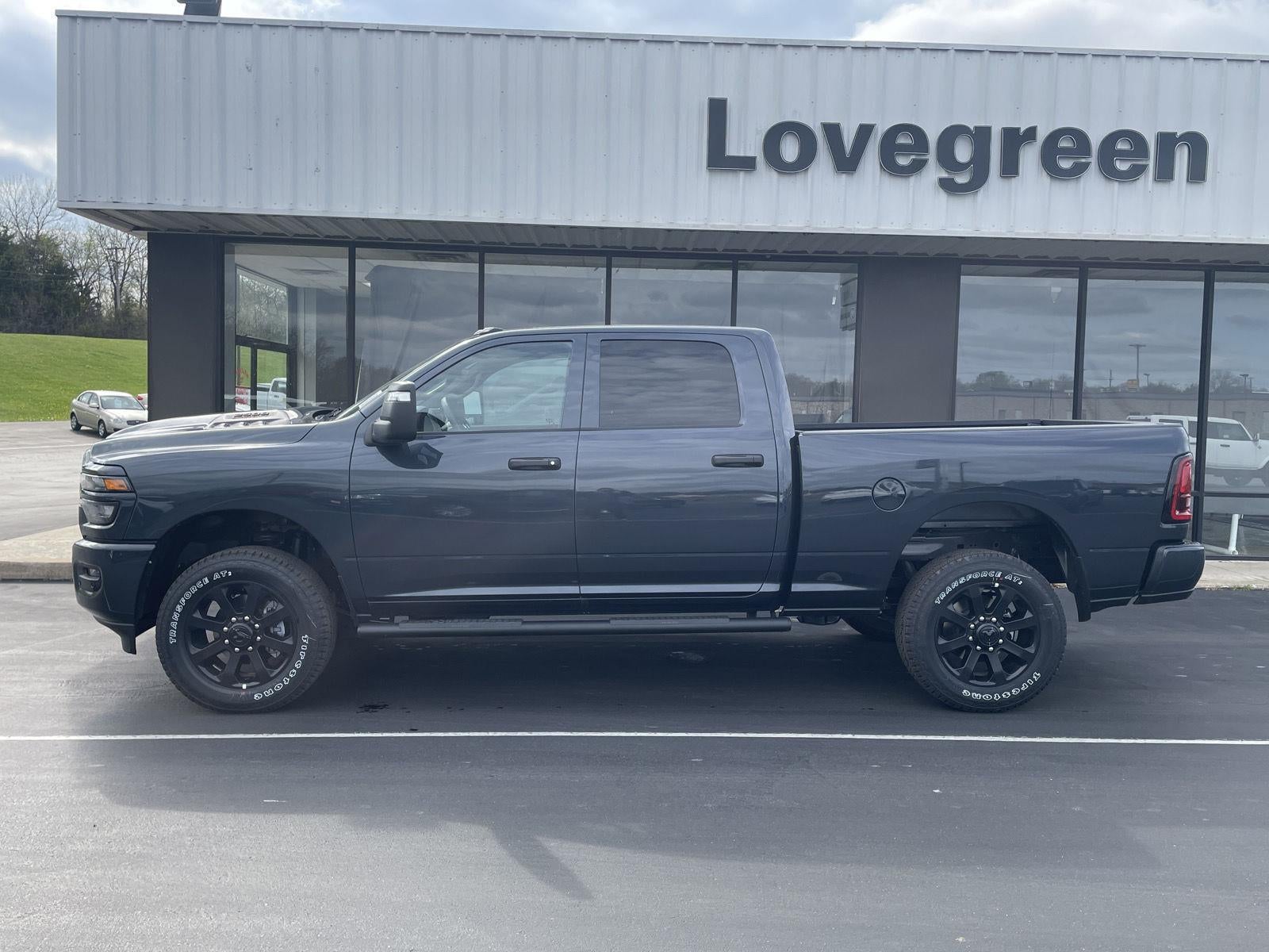2026 RAM Ram 2500 RAM 2500 BLACK EXPRESS CREW CAB 4X4 6'4' BOX in Forged Blue Metallic Exterior Paint — front three-quarter view
